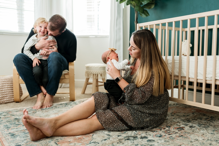 Parents in nursery holding their children.
