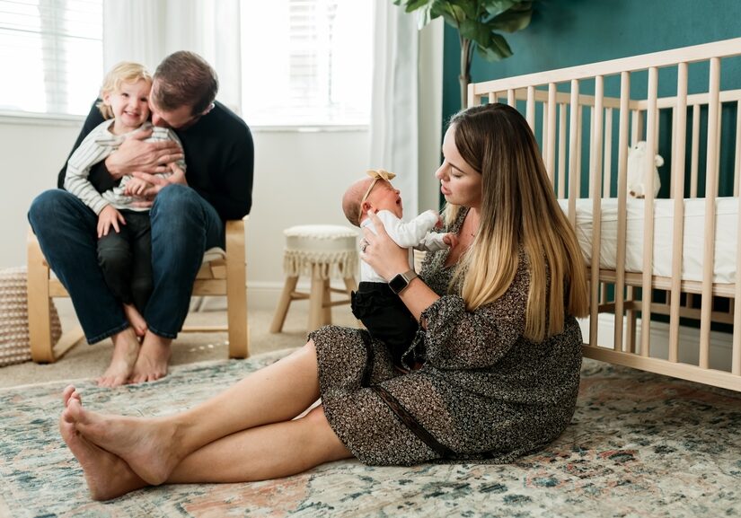 Parents in nursery holding their children.